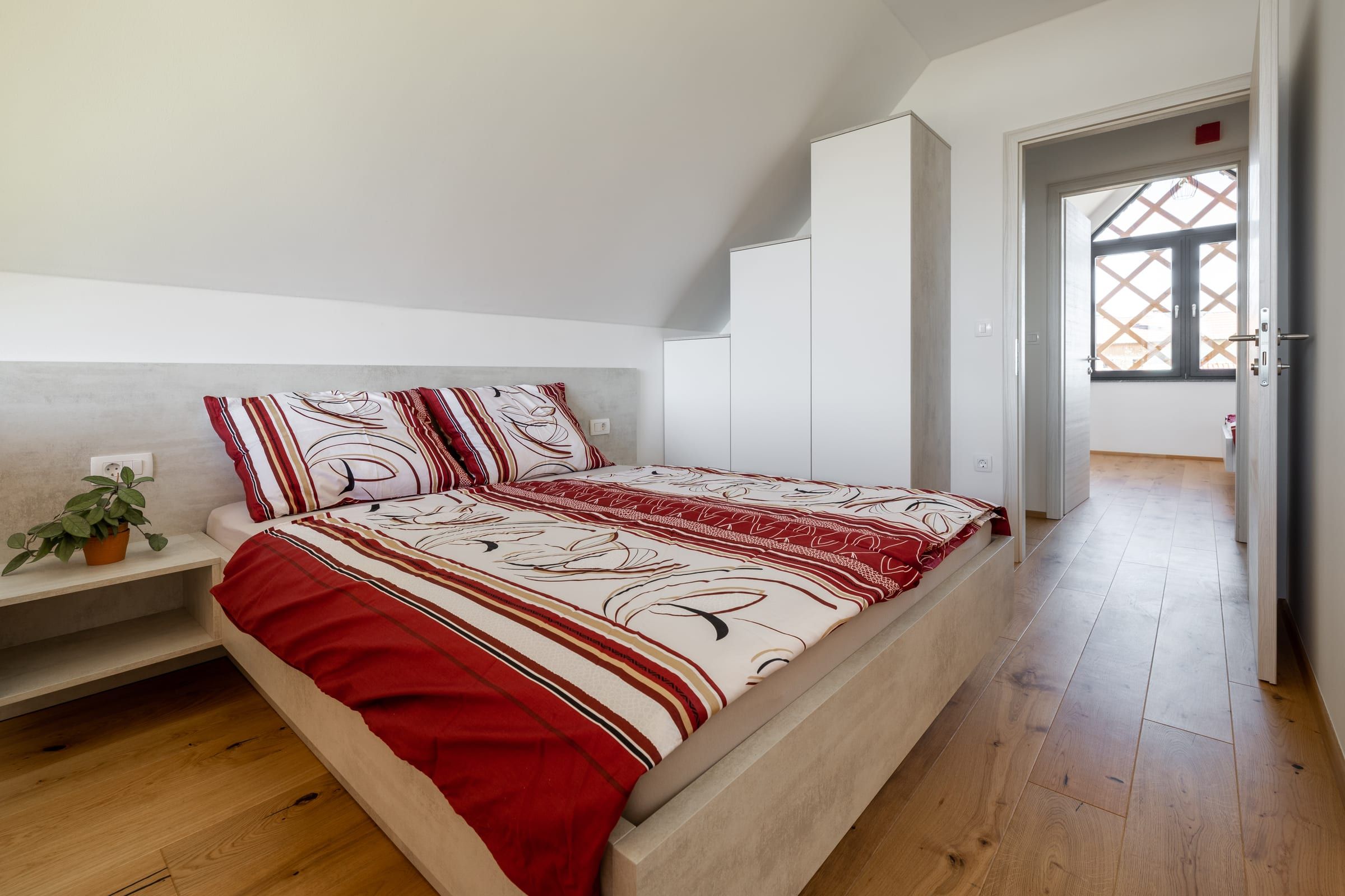 The second double bedroom, bright and calm with oak flooring.