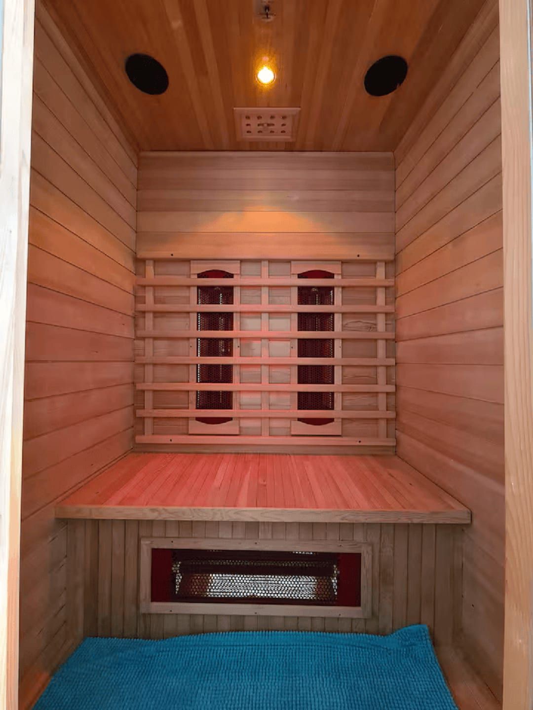 Inside the villa's infrared sauna, glowing warm under the eaves.